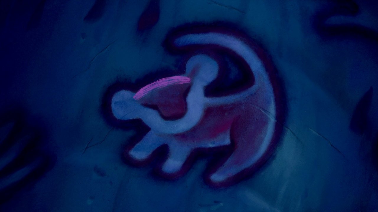 Close-up of the Simba portrait Rafiki has drawn in earth pigments on a tree. The cub is rendered in blue, red, and white.