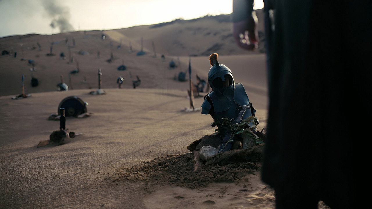 Helmets and weapons left across a battlefield in Christopher Nolan's The Odyssey